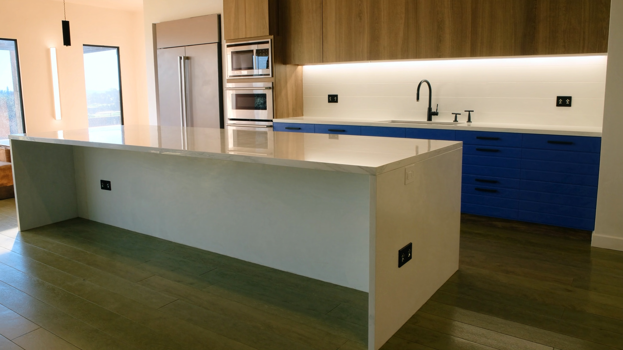 Completed upscale kitchen remodel with blue cabinetry